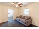 Living room with tile flooring, a comfortable couch, and a view into the kitchen at 3027 Maplewood Ave, Lakeland, FL 33803