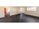Open living area with sleek flooring, bright windows, and views of the surrounding neighborhood at 3027 Maplewood Ave, Lakeland, FL 33803