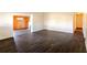 Spacious living room with stylish flooring, wood-paneled accent wall, and a cozy fireplace at 3027 Maplewood Ave, Lakeland, FL 33803