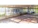 Bright sunroom with tile floors, large windows and outdoor views at 3027 Maplewood Ave, Lakeland, FL 33803