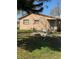 View of the side of the house with a back door and patio space at 334 Main St, Haines City, FL 33844
