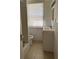 Small bathroom featuring a tub and shower combination and vanity with sink at 334 Main St, Haines City, FL 33844