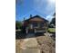 Charming bungalow with a covered front porch, steps, and a walkway leading to the house at 334 Main St, Haines City, FL 33844