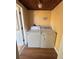 A small laundry room with old washer and dryer at 334 Main St, Haines City, FL 33844