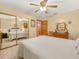 Bright bedroom features mirrored closet doors, a ceiling fan, and wood furniture at 3471 Black Jack Ct, Lake Wales, FL 33898