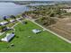 An aerial view of a neighborhood of houses with large yards, some near a lake at 3608 Garrard Rd, Fort Meade, FL 33841