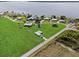 An aerial view of a home on a large lot, near a lake and other residences at 3608 Garrard Rd, Fort Meade, FL 33841