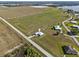 Sprawling property showcasing a modern home, set amidst lush fields and serene waterfront views at 3608 Garrard Rd, Fort Meade, FL 33841
