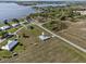 An aerial view of a home on a large lot, near a lake and other residences at 3608 Garrard Rd, Fort Meade, FL 33841