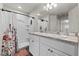 Bathroom featuring a double vanity, walk-in shower with curtain, and modern fixtures at 3608 Garrard Rd, Fort Meade, FL 33841