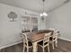 Cozy dining area features a rustic wooden table and bright window at 3608 Garrard Rd, Fort Meade, FL 33841