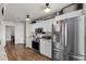 Modern kitchen with stainless steel appliances and white cabinets, providing ample storage at 3608 Garrard Rd, Fort Meade, FL 33841