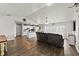 Inviting living area with wood floors, neutral colors, and an open layout to the kitchen at 3608 Garrard Rd, Fort Meade, FL 33841