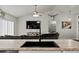 Open-concept living room with a large television, stylish décor, and comfortable seating at 3608 Garrard Rd, Fort Meade, FL 33841