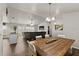 Open-concept living area with vaulted ceilings, seamlessly connecting the dining and living spaces at 3608 Garrard Rd, Fort Meade, FL 33841