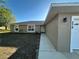 Inviting home exterior with a well-manicured lawn, clear address, and a neatly paved walkway to the front door at 379 Renssalaer Ave, Auburndale, FL 33823