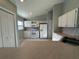 Well-lit kitchen featuring white cabinets, tile flooring, and updated appliances at 379 Renssalaer Ave, Auburndale, FL 33823