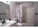 Bathroom featuring a combined shower and tub, a vanity with a dark faucet, and a toilet at 398 Winter Ridge Blvd # 398, Winter Haven, FL 33881