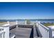 Enjoy waterfront views from the community deck featuring bench seating and white railings at 398 Winter Ridge Blvd # 398, Winter Haven, FL 33881