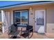 Welcoming front entrance with outdoor seating, providing a charming space to relax and enjoy the surroundings at 398 Winter Ridge Blvd # 398, Winter Haven, FL 33881
