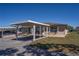 Charming single-story home with a covered carport and lovely landscaping, perfect for relaxed outdoor living at 398 Winter Ridge Blvd # 398, Winter Haven, FL 33881
