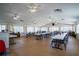 Community hall features rows of tables and chairs under many ceiling fans at 398 Winter Ridge Blvd # 398, Winter Haven, FL 33881