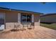 Private rear patio area featuring brick pavers, a table, and two chairs at 398 Winter Ridge Blvd # 398, Winter Haven, FL 33881