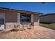 Comfortable outdoor patio featuring a table and chairs on brick pavers at 398 Winter Ridge Blvd # 398, Winter Haven, FL 33881