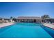 Community pool area with lounge chairs and shade pavilion for residents at 398 Winter Ridge Blvd # 398, Winter Haven, FL 33881