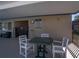 Community pool area featuring tables, chairs, and covered area at 398 Winter Ridge Blvd # 398, Winter Haven, FL 33881