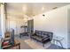 Sunroom featuring a ceiling fan, sliding glass doors, a dark leather sofa, and a weight lifting station at 398 Winter Ridge Blvd # 398, Winter Haven, FL 33881
