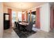 Elegant dining room featuring a contemporary chandelier and access to the outdoor space at 4004 Prima Lago Cir, Lakeland, FL 33810