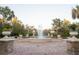 Water fountain with stone flower pots and a spacious brick-paved surrounding at 4004 Prima Lago Cir, Lakeland, FL 33810