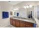 Bright bathroom featuring double sinks, granite counters, and lots of room for storage at 4009 Bedford Ave, Winter Haven, FL 33884