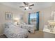 Bright bedroom with two twin beds, ceiling fan, and window at 4009 Bedford Ave, Winter Haven, FL 33884