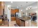 Well-equipped kitchen features stainless steel appliances, an island with a sink and seating, and wood cabinetry at 4009 Bedford Ave, Winter Haven, FL 33884
