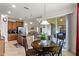 Open concept kitchen with island seating and breakfast nook leading to an outdoor patio at 4009 Bedford Ave, Winter Haven, FL 33884