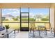 The screened lanai overlooks the green backyard at 4009 Bedford Ave, Winter Haven, FL 33884