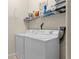 Laundry area featuring washer, dryer, wire rack and storage at 4009 Bedford Ave, Winter Haven, FL 33884
