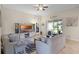 Bright living room featuring tile floors, cozy seating, and access to the patio at 4009 Bedford Ave, Winter Haven, FL 33884