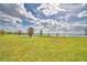 Expansive backyard with lake views, lush green grass, and canal at 404 Laurel Cove Way # 404, Winter Haven, FL 33884