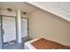 Condo entrance featuring two white doors, neutral wall textures, and a welcoming outdoor rug at 404 Laurel Cove Way # 404, Winter Haven, FL 33884