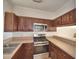 Updated kitchen featuring stainless steel appliances, ample cabinetry, and sleek countertops at 404 Laurel Cove Way # 404, Winter Haven, FL 33884