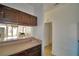 Cozy kitchen view with cabinets, tile floors, and an opening to the rest of the living area at 404 Laurel Cove Way # 404, Winter Haven, FL 33884