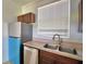 Bright kitchen with stainless steel appliances and a window at 404 Laurel Cove Way # 404, Winter Haven, FL 33884