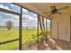 Screened lanai with brick floor, ceiling fan and views of the lake at 404 Laurel Cove Way # 404, Winter Haven, FL 33884
