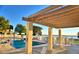Relaxing poolside view with an inviting pergola, ideal for lounging and taking in scenic lake views at 404 Laurel Cove Way # 404, Winter Haven, FL 33884