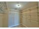 Organized walk-in closet equipped with wire shelving, maximizing storage space and functionality at 404 Laurel Cove Way # 404, Winter Haven, FL 33884