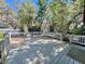 Back deck surrounded by lush trees at 407 Paradise Island Dr, Haines City, FL 33844