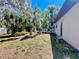 Backyard with mature landscaping and wooden deck at 407 Paradise Island Dr, Haines City, FL 33844